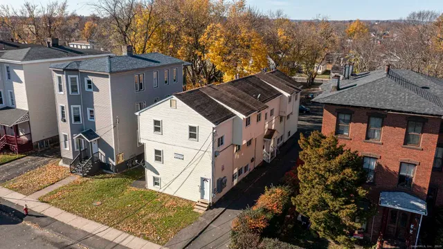 a view of a house with a yard from a balcony