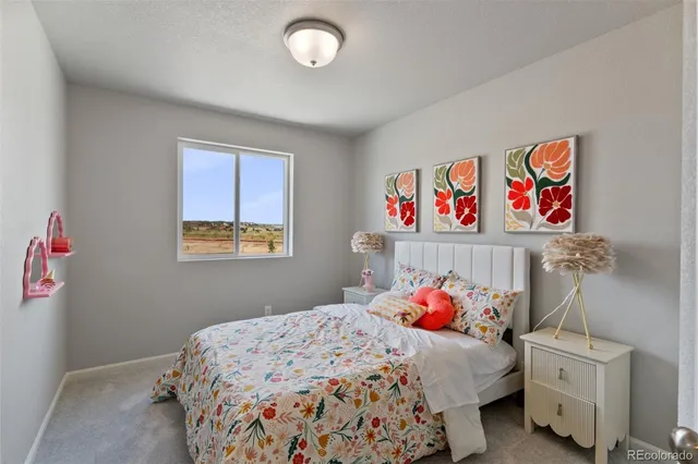 a bedroom with a bed and cabinets