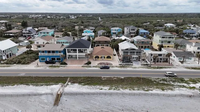 an aerial view of residential houses with outdoor space