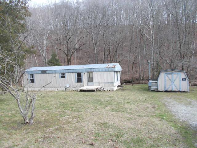 785 Cates Road Lawrenceburg, TN 38464 - Photo 17 of 17 a view of a house with backyard and trees