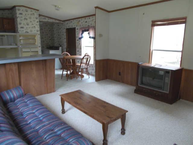 785 Cates Road Lawrenceburg, TN 38464 - Photo 3 of 17 a living room with furniture and a fireplace