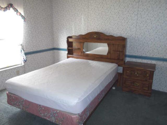 785 Cates Road Lawrenceburg, TN 38464 - Photo 7 of 17 a bedroom with a bed and a window