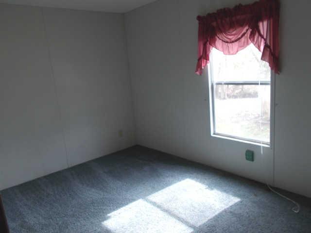 785 Cates Road Lawrenceburg, TN 38464 - Photo 8 of 17 an empty room with a window