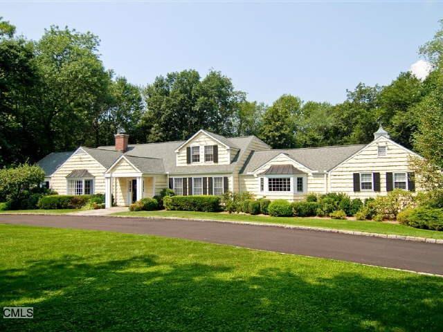 16 Dewart Road Greenwich, CT 06830 - Photo 1 of 1 a front view of a house with a garden