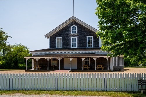 26 Flint Hill Road Vineyard Haven, MA 02568 - Photo 12 of 13 a front view of a house with a yard
