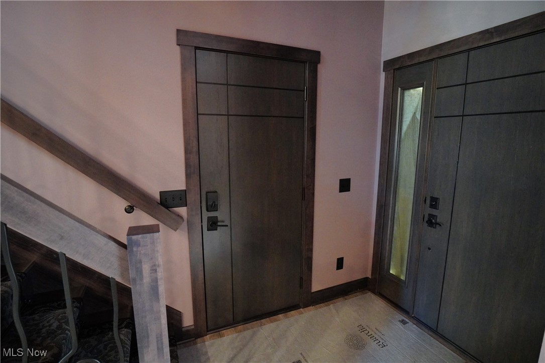 2502 Charing Cross Road Northwest Canton, OH 44708 - Photo 5 of 12 Entryway with high ceiling and custom doors throughout