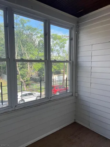 a view of lot of window and cabinets