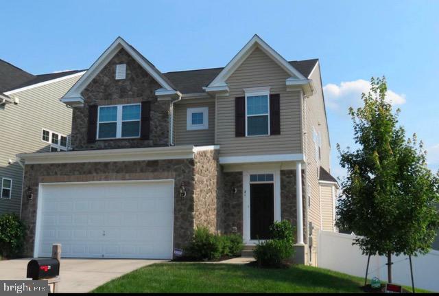 21 Runyon Drive Stafford, VA 22554 - Photo 1 of 43 a front view of a house with a yard and garage