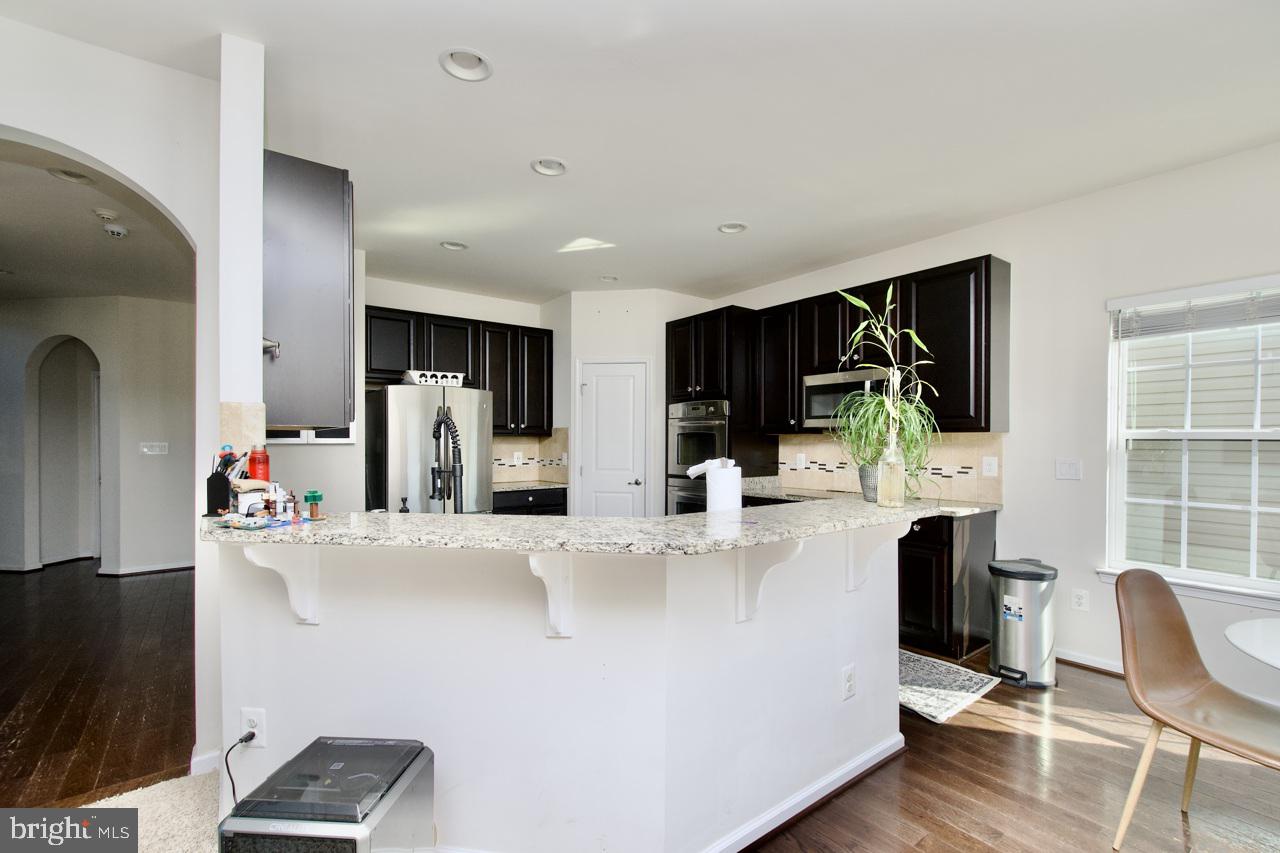 21 Runyon Drive Stafford, VA 22554 - Photo 12 of 43 a view of kitchen living room with furniture and flat screen tv