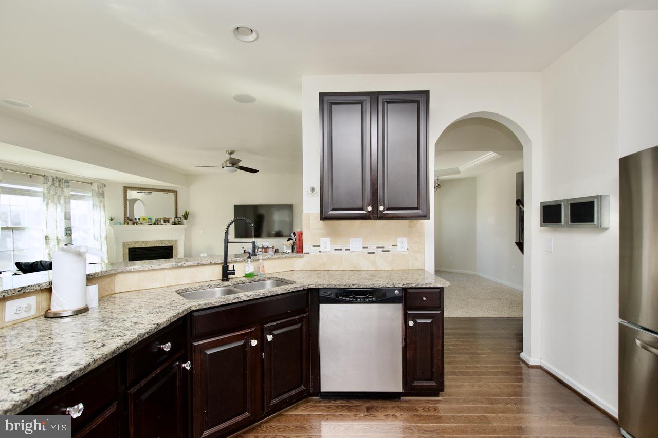 21 Runyon Drive Stafford, VA 22554 - Photo 15 of 43 a kitchen with granite countertop a sink and cabinets