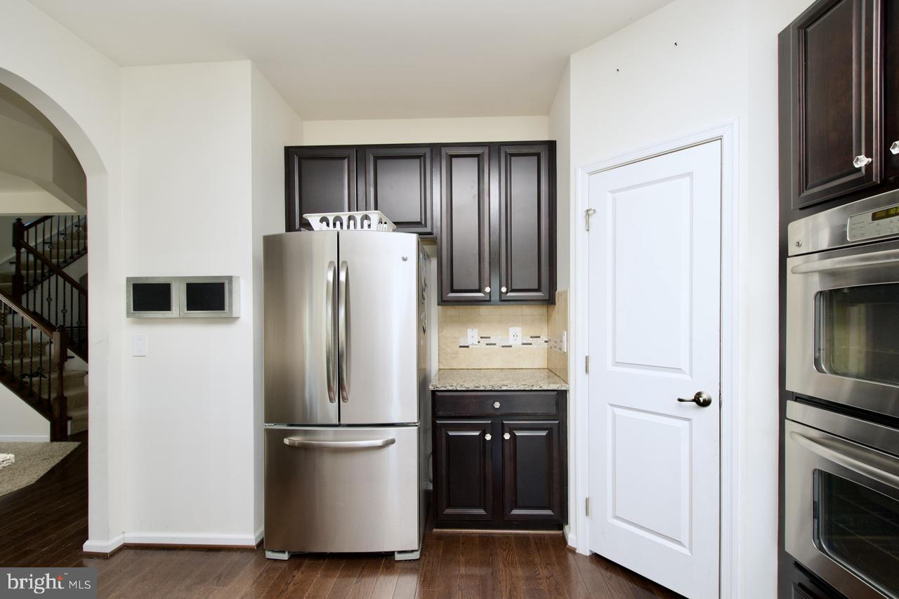 21 Runyon Drive Stafford, VA 22554 - Photo 16 of 43 a kitchen with stainless steel appliances a refrigerator stove and microwave