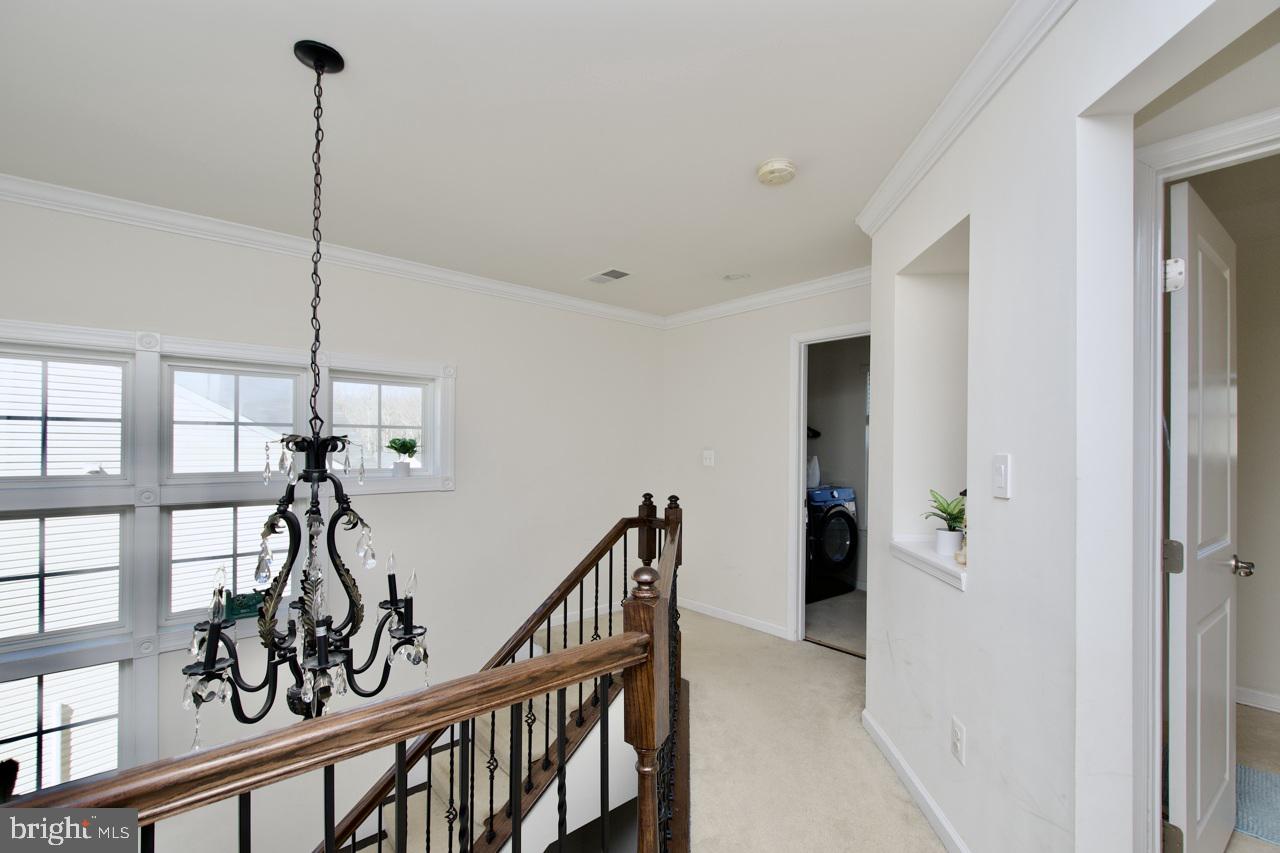 21 Runyon Drive Stafford, VA 22554 - Photo 20 of 43 a view of hallway with a chandelier