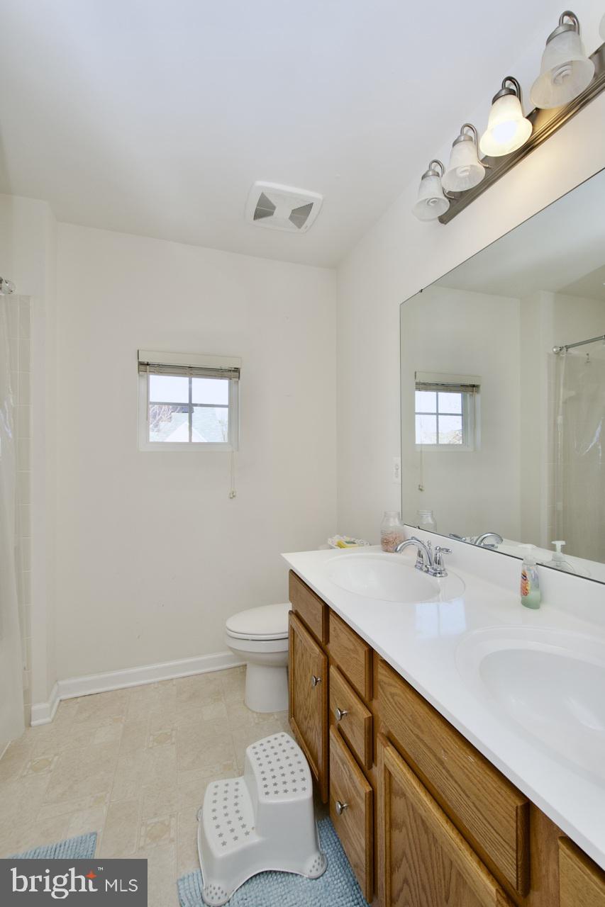 21 Runyon Drive Stafford, VA 22554 - Photo 24 of 43 a bathroom with a sink a toilet and mirror