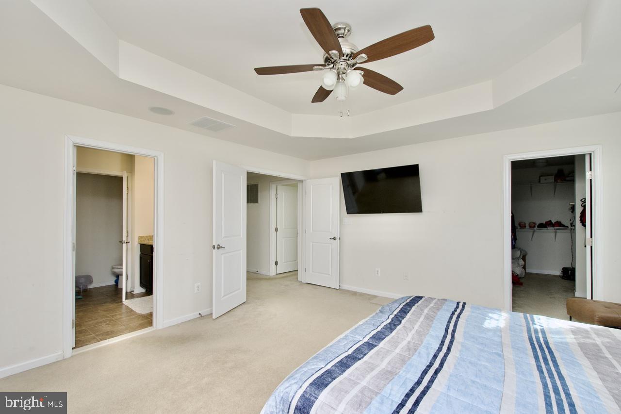 21 Runyon Drive Stafford, VA 22554 - Photo 30 of 43 a bedroom with a bed and a flat screen tv