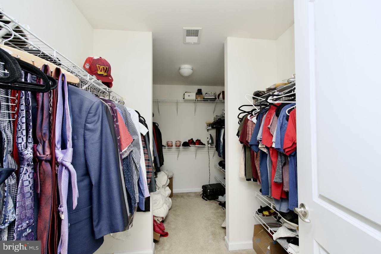 21 Runyon Drive Stafford, VA 22554 - Photo 31 of 43 a view of walk in closet with clothes and shoes