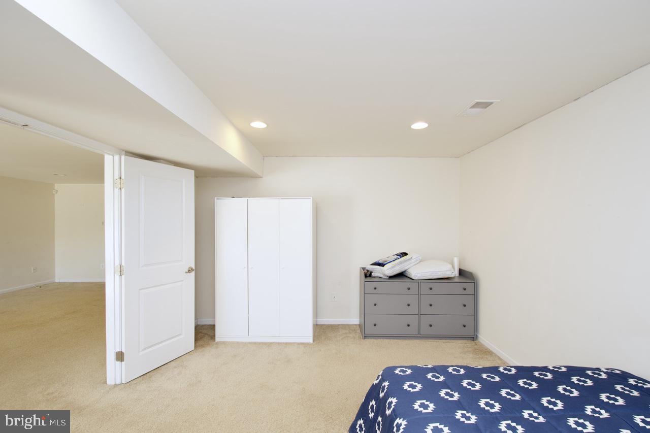 21 Runyon Drive Stafford, VA 22554 - Photo 38 of 43 a spacious bedroom with a bed and a view of bathroom