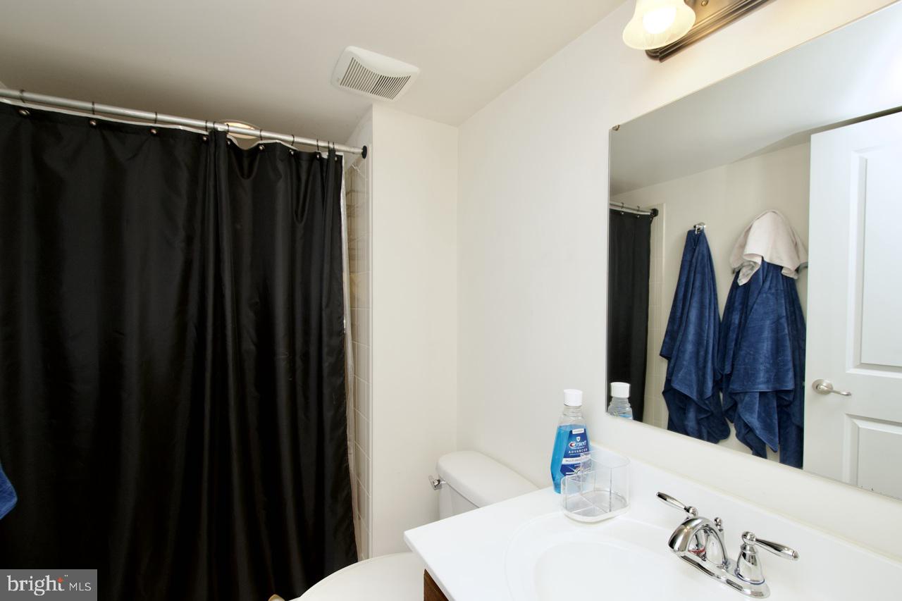 21 Runyon Drive Stafford, VA 22554 - Photo 39 of 43 a bathroom with a sink and a shower curtain