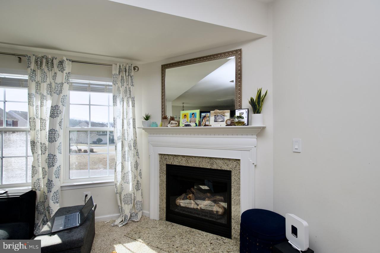 21 Runyon Drive Stafford, VA 22554 - Photo 9 of 43 a living room with furniture and a fireplace