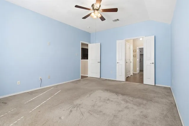 a view of a big room with carpet