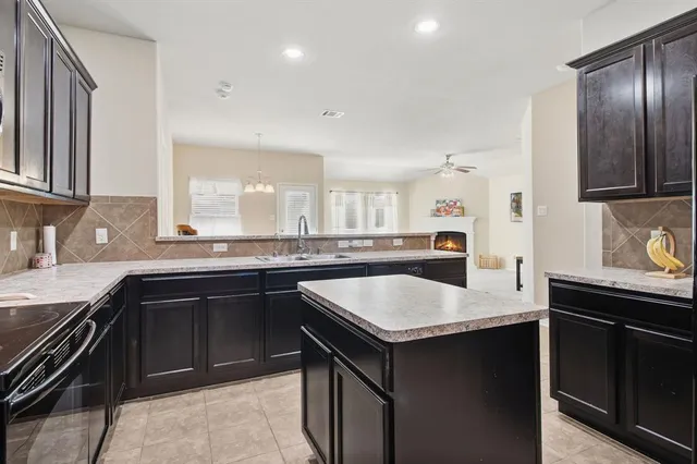 a kitchen with a sink and stove