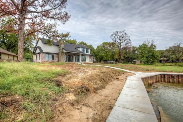 a view of house with swimming pool outdoor seating