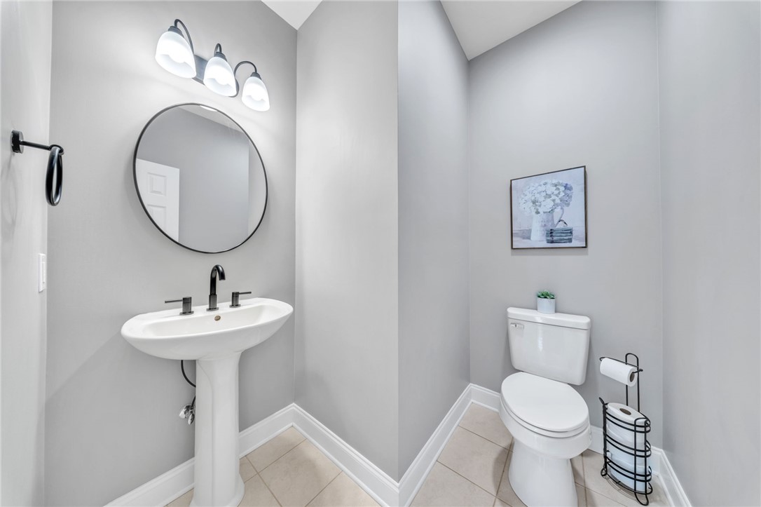 102 Country Walk Lane Clemson, SC 29631 - Photo 14 of 39 A compact and chic powder room with a pedestal sink and modern fixtures awaits.