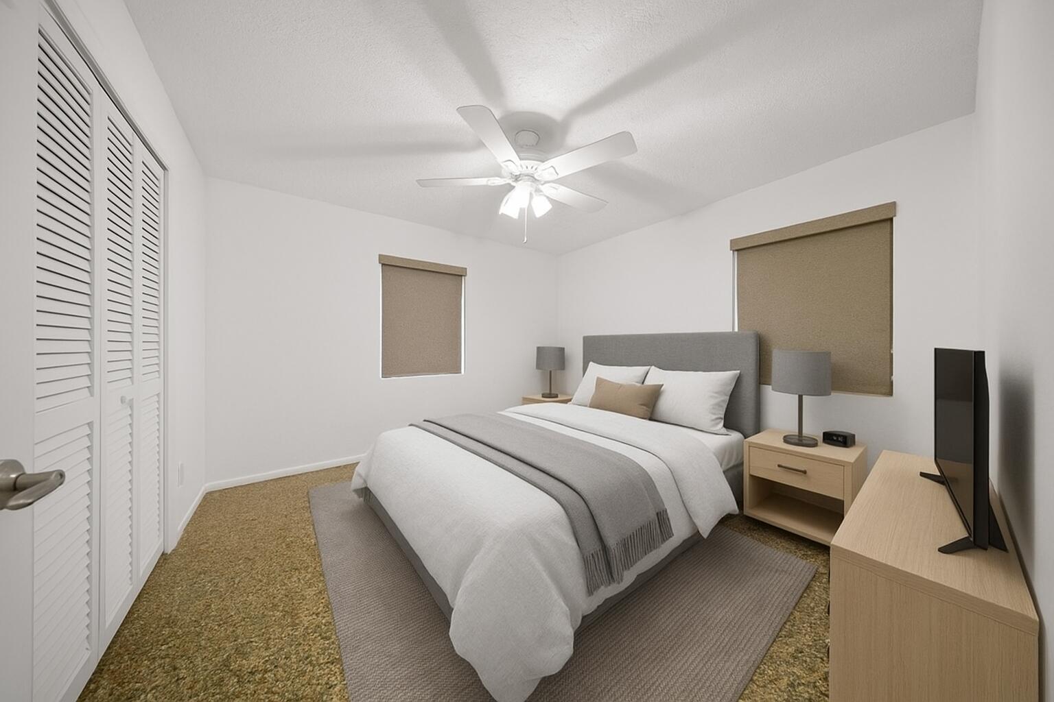 311 Granada Street Fort Pierce, FL 34949 - Photo 28 of 58 a bedroom with a bed and a chandelier