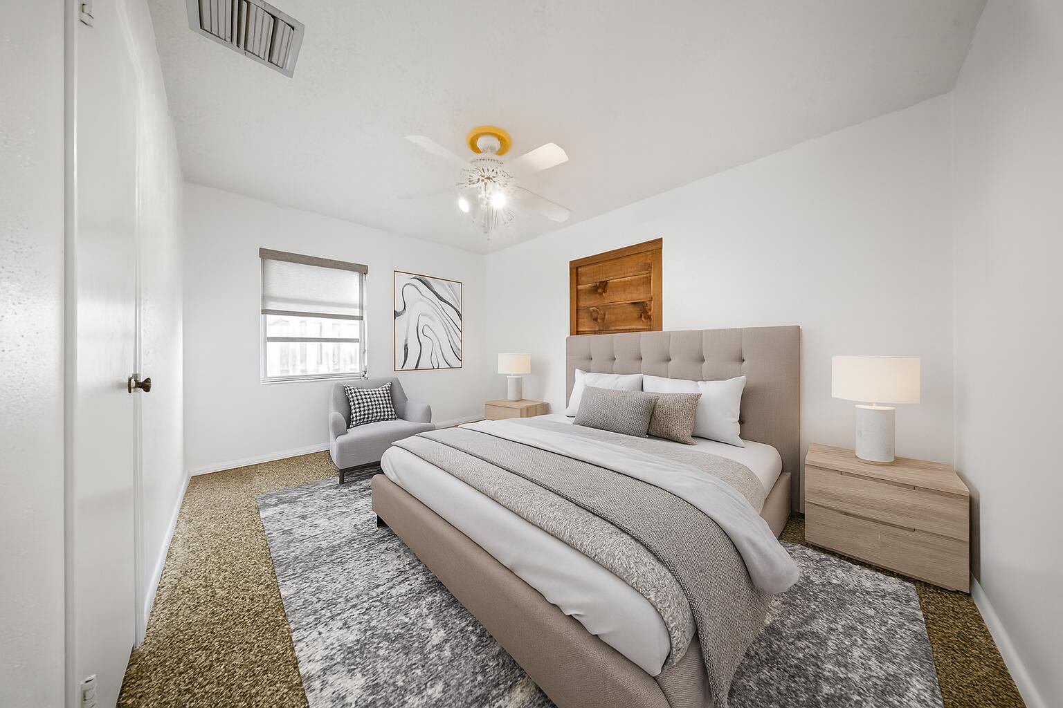 311 Granada Street Fort Pierce, FL 34949 - Photo 31 of 58 a bedroom with a bed and a window