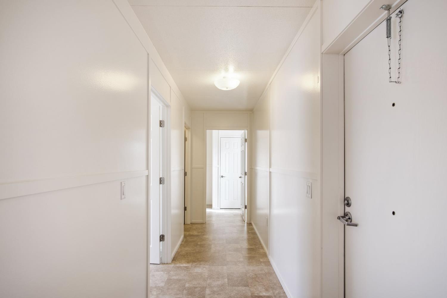 1400 Meredith Avenue, Unit 81 Gustine, CA 95322 - Photo 25 of 29 a view of a hallway