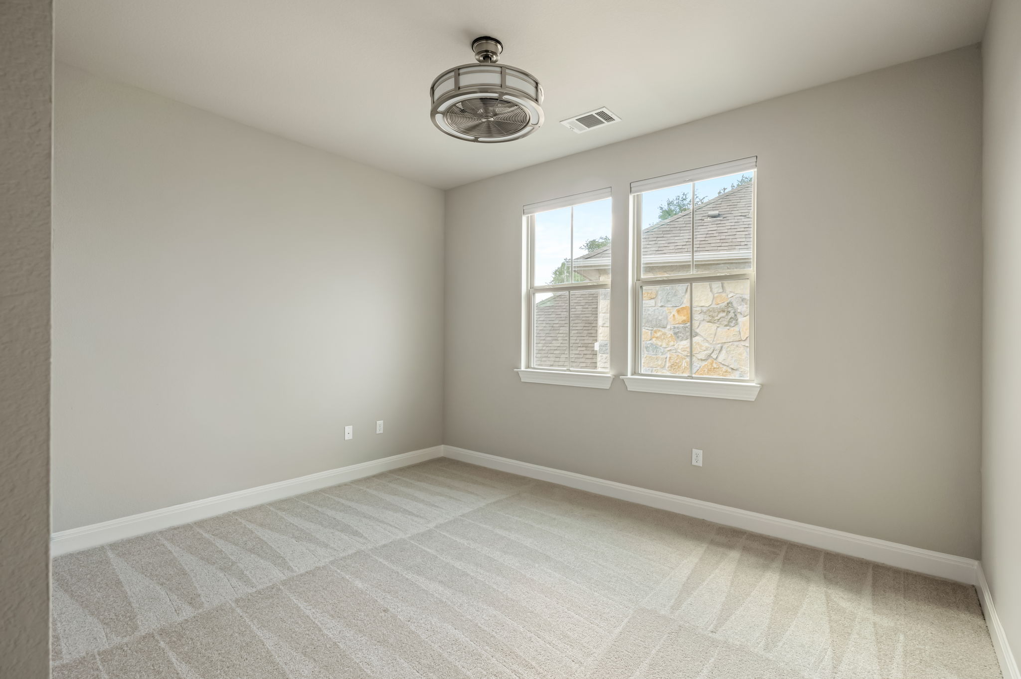 2516 Hopsack Mills Road Austin, TX 78748 - Photo 28 of 39 Light grey painted walls complement the patterned carpet flooring