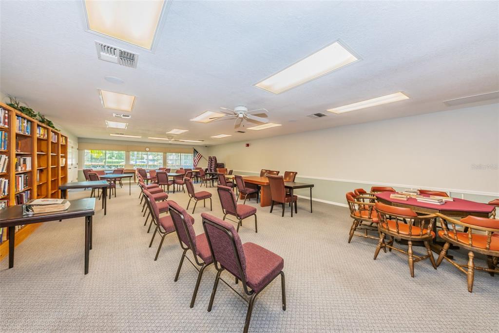 9427 Cape Charles Avenue New Port Richey, FL 34655 - Photo 41 of 82 a group of people sitting at tables in a room