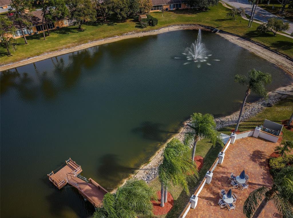 9427 Cape Charles Avenue New Port Richey, FL 34655 - Photo 68 of 82 an aerial view of a house with a yard swimming pool and outdoor seating