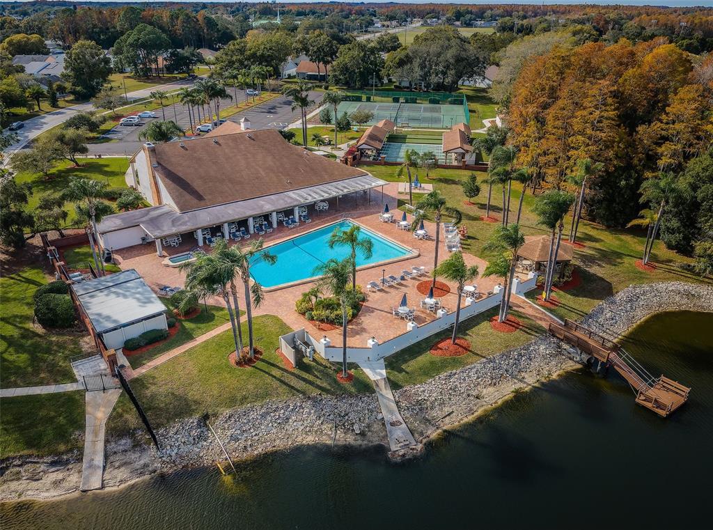 9427 Cape Charles Avenue New Port Richey, FL 34655 - Photo 70 of 82 an aerial view of a house with a yard basket ball court and outdoor seating