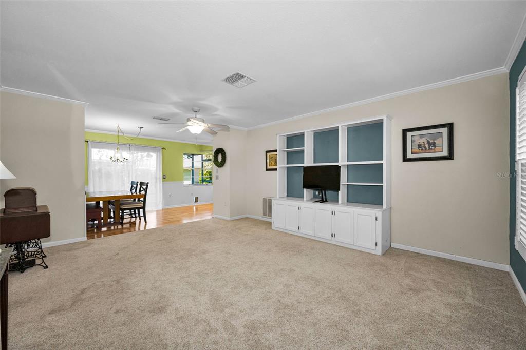 9427 Cape Charles Avenue New Port Richey, FL 34655 - Photo 7 of 82 a view of a livingroom with furniture and a flat screen tv