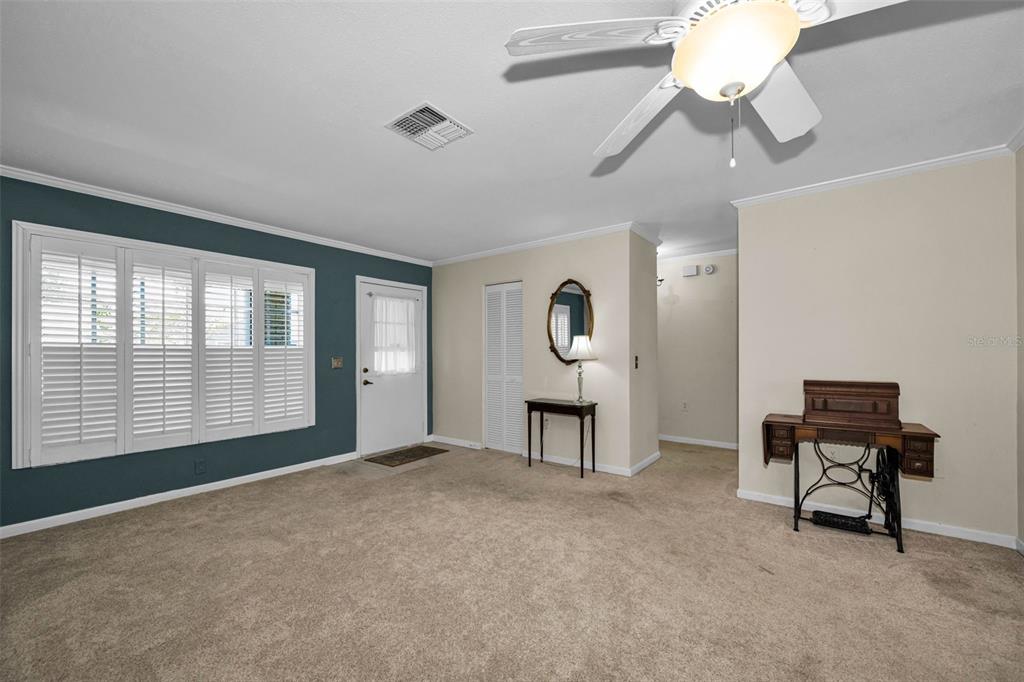 9427 Cape Charles Avenue New Port Richey, FL 34655 - Photo 10 of 82 a view of a workspace with furniture and a window