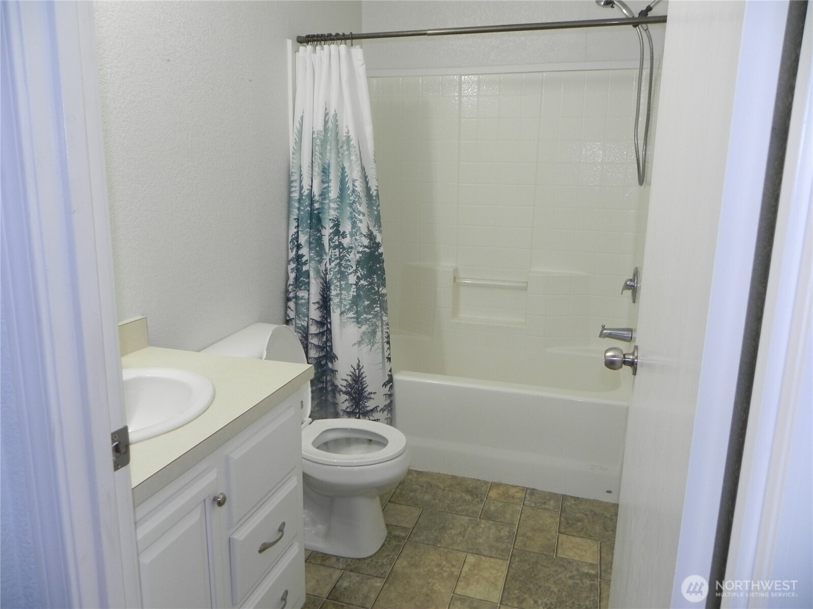 230 Silver Street Republic, WA 99166 - Photo 12 of 25 a bathroom with a granite countertop bathtub shower sink and toilet