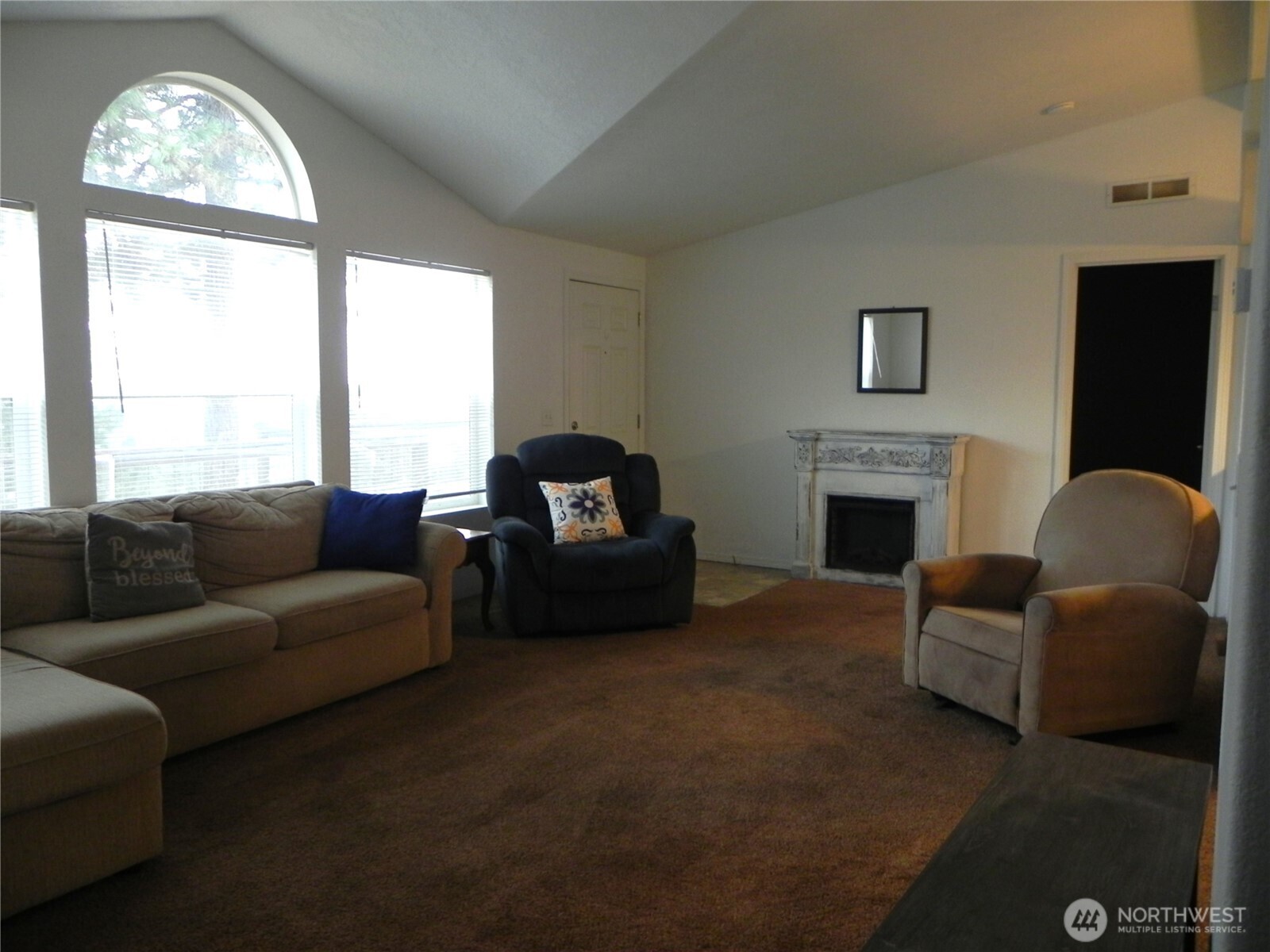 230 Silver Street Republic, WA 99166 - Photo 5 of 25 a living room with furniture a fireplace and a large window