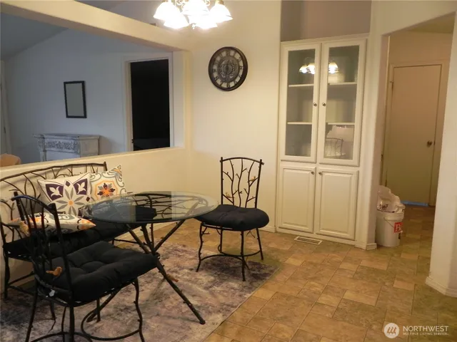 a kitchen with cabinets a sink and appliances