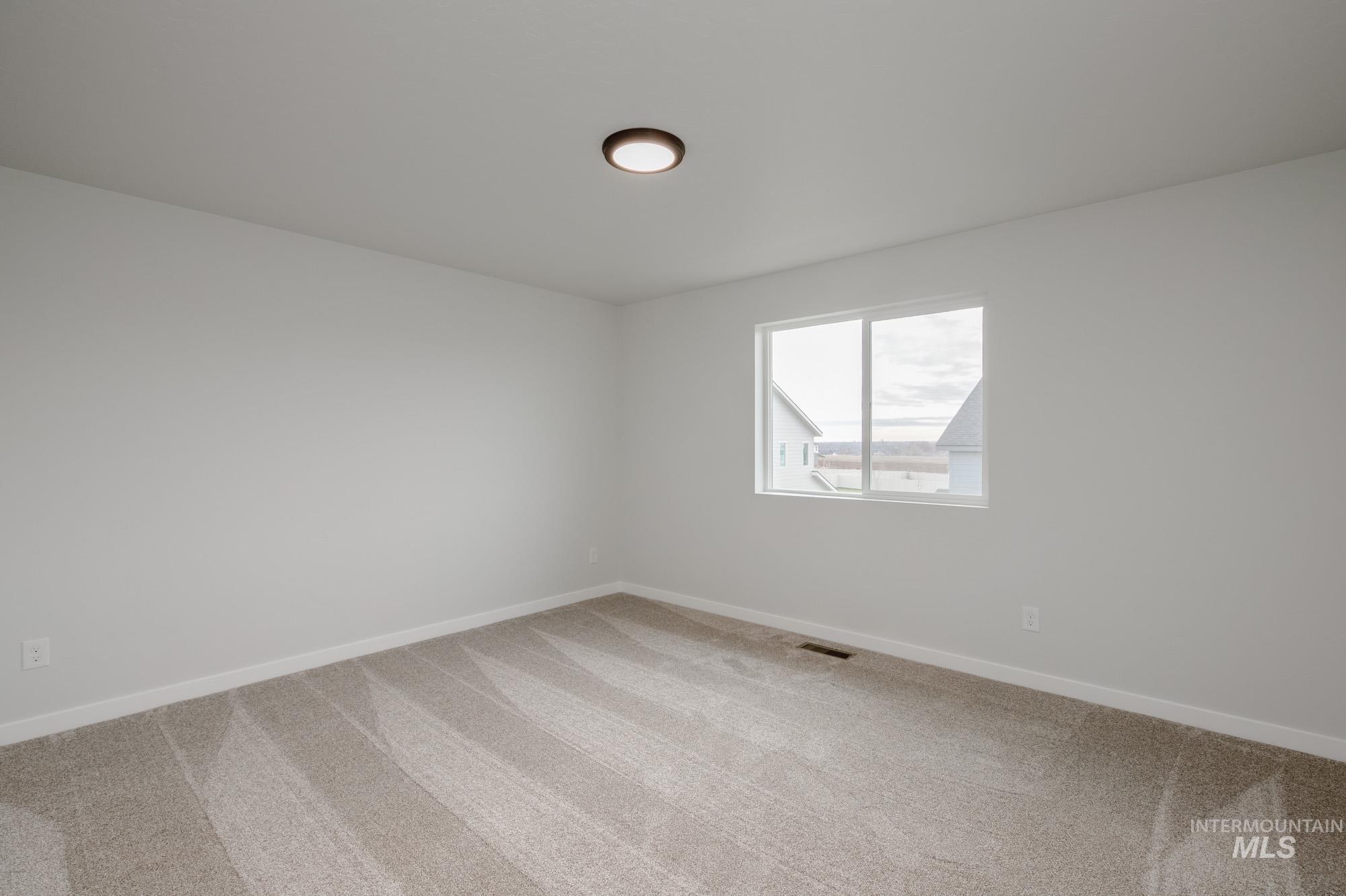 10575 West Teratai Street Star, ID 83669 - Photo 19 of 26 Empty room with carpet flooring
