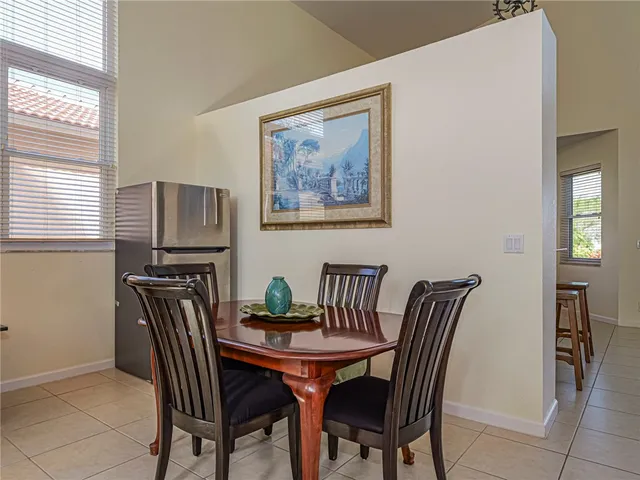 a view of a dining room with furniture and window