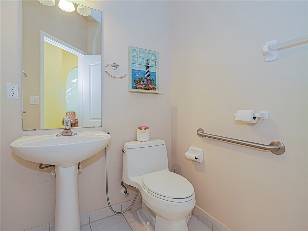 6258 Arlington Way Fort Pierce, FL 34951 - Photo 16 of 36 a bathroom with a sink mirror and toilet