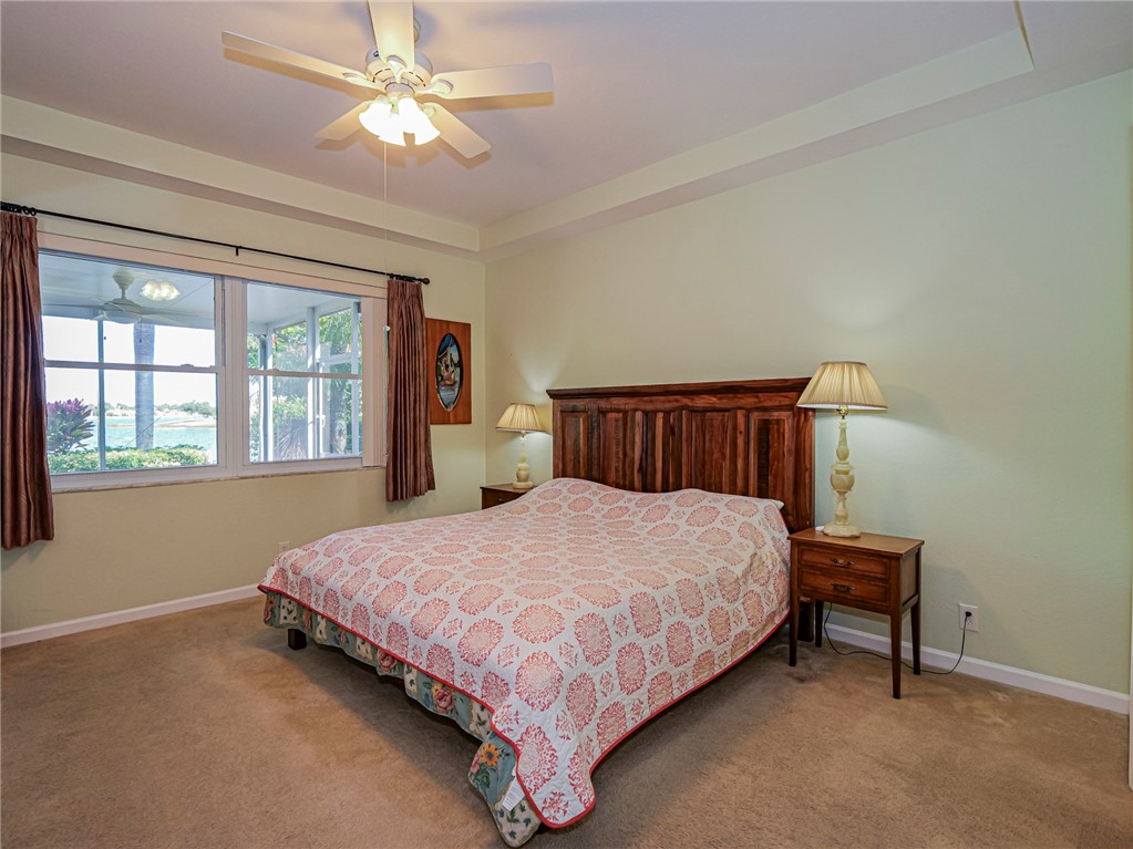 6258 Arlington Way Fort Pierce, FL 34951 - Photo 17 of 36 a bedroom with a bed and a window