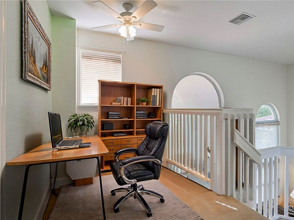 6258 Arlington Way Fort Pierce, FL 34951 - Photo 19 of 36 a view of a workspace with furniture and a window