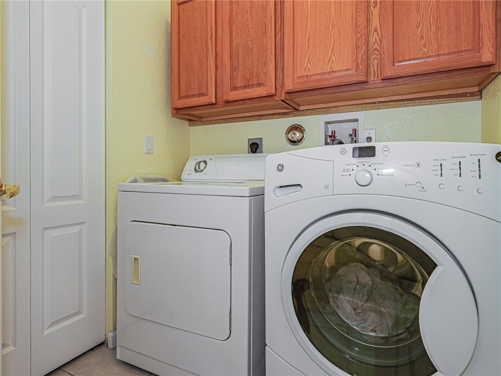 6258 Arlington Way Fort Pierce, FL 34951 - Photo 25 of 36 a utility room with dryer and washer