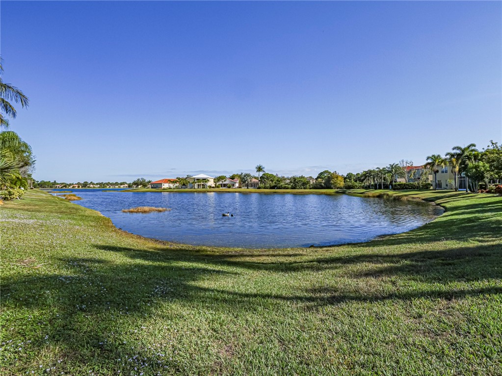 6258 Arlington Way Fort Pierce, FL 34951 - Photo 29 of 36 a view of a lake with houses in the back