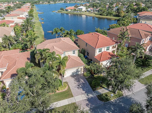 an aerial view of a house with a lake view