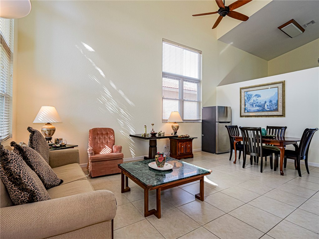 6258 Arlington Way Fort Pierce, FL 34951 - Photo 6 of 36 a living room with furniture a rug and a window
