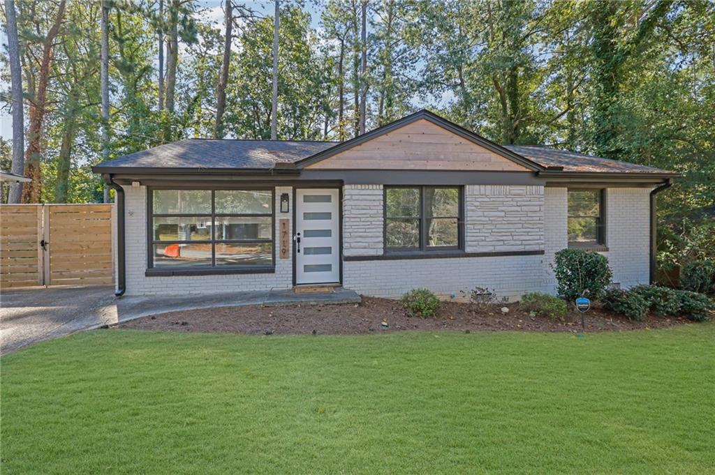 1719 San Gabriel Avenue Decatur, GA 30032 - Photo 1 of 1 a front view of a house with a yard