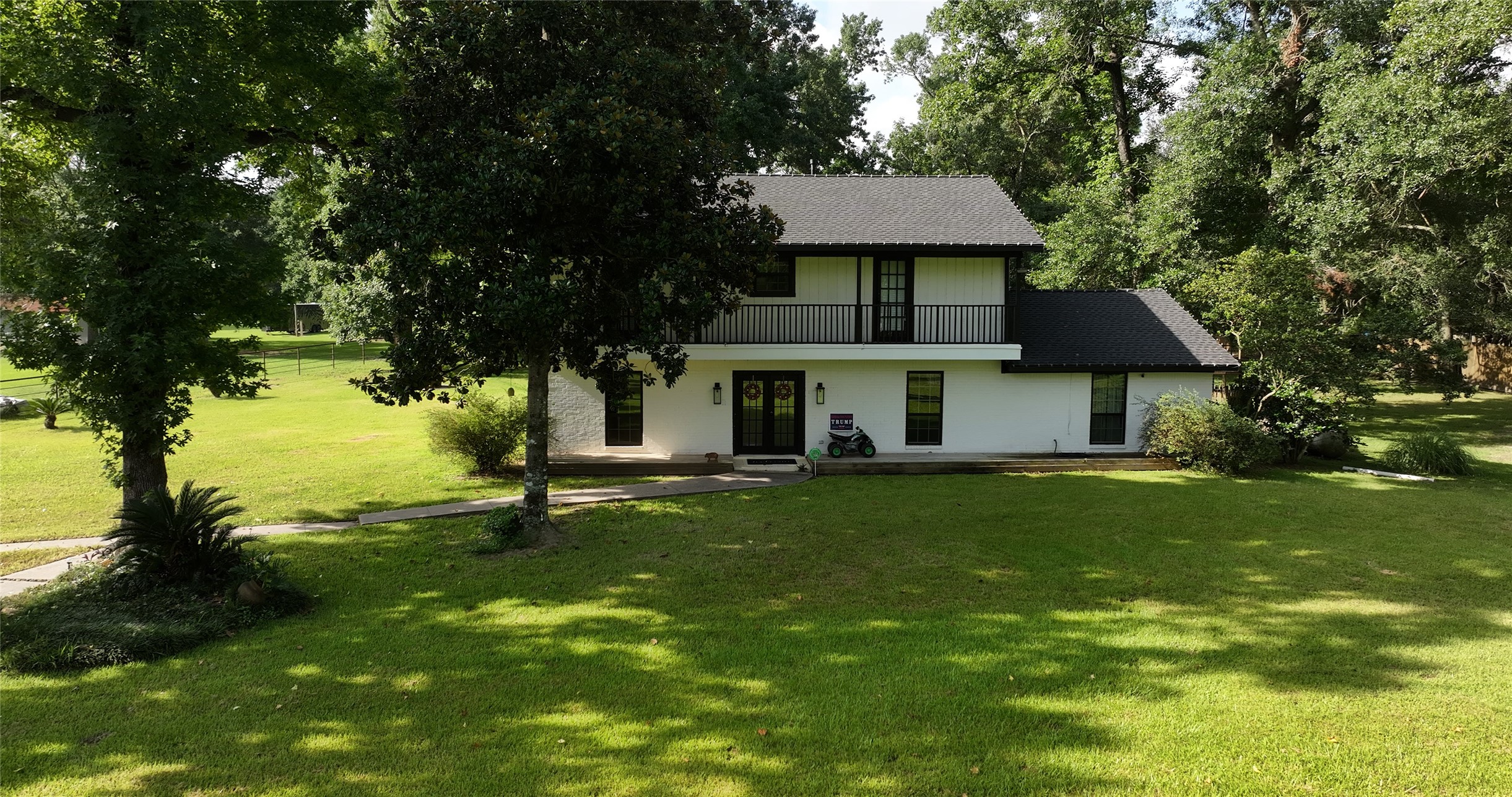 11291-2 Darby Loop Conroe, TX 77385 - Photo 12 of 18 a front view of a house with a garden