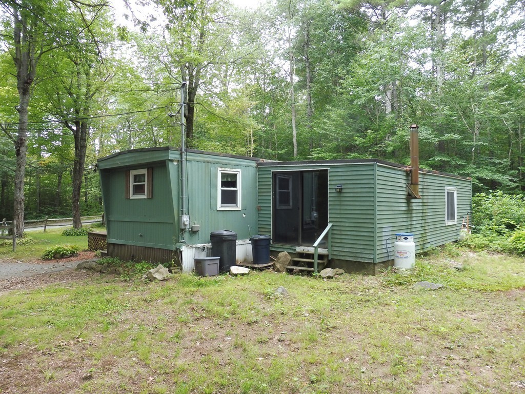 145 Holt Road Ashburnham, MA 01430 - Photo 12 of 13 a view of a house with backyard